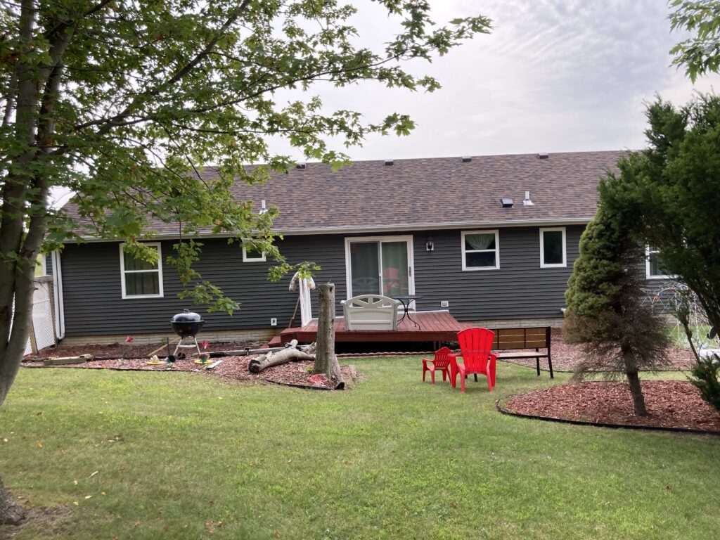 Finished - Roofing Shingles, Vinyl Siding, Gutters and Downspouts Removed and Replaced in West Branch, Iowa. Back of home
