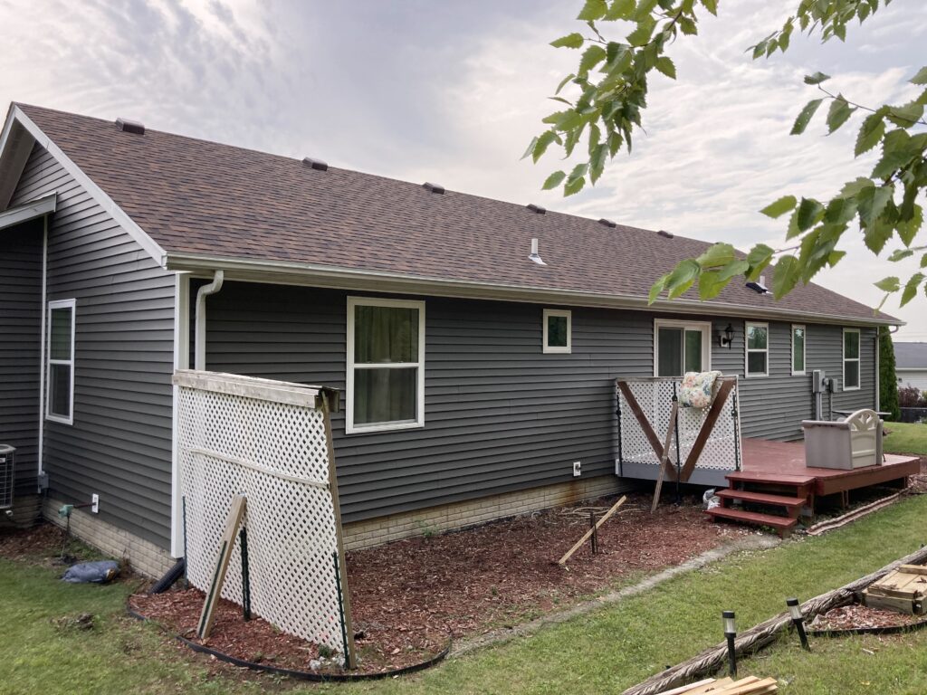 Finished view of Roofing Shingles, Vinyl Siding, Gutters and Downspouts Removed and Replaced in West Branch, Iowa. Back of the home