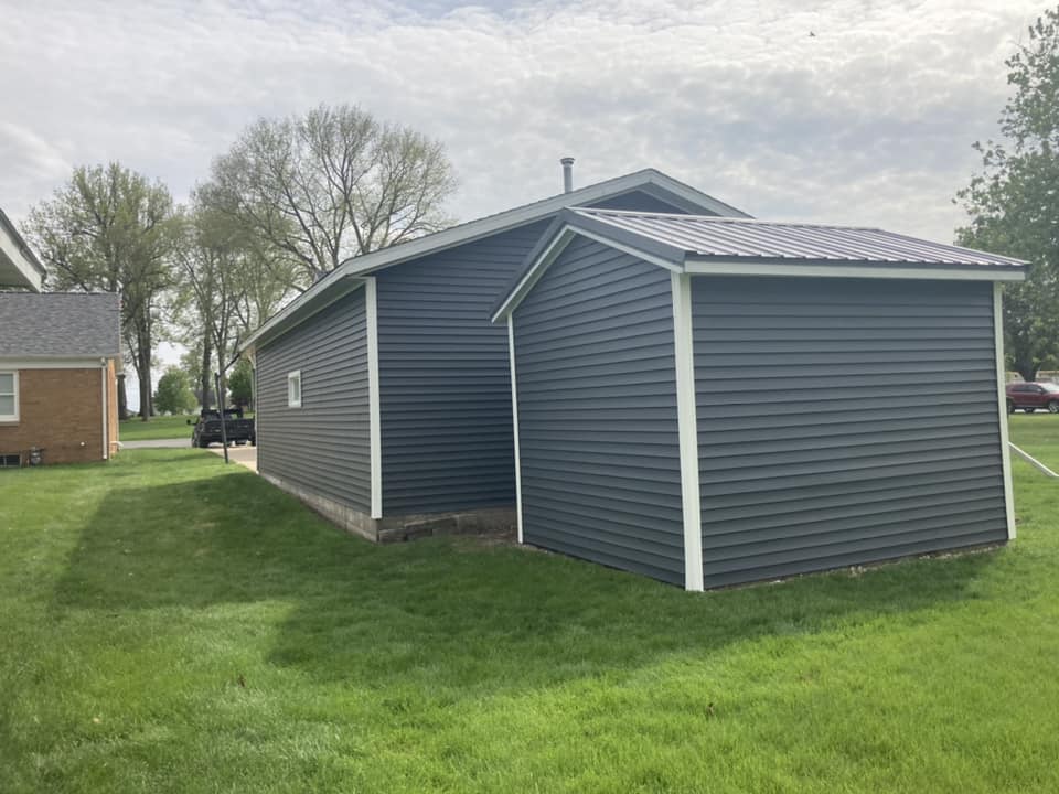 Finished vinyl siding installed on a garage in Durant, Iowa