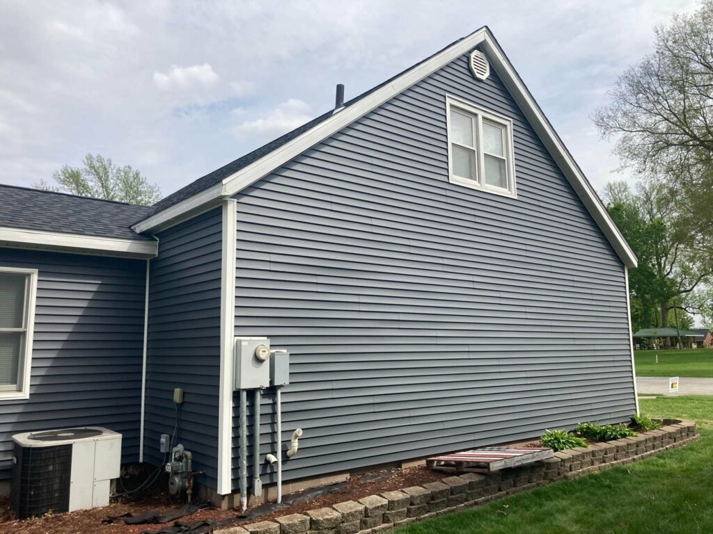 Finished vinyl siding installed on the side of a home in Durant, Iowa