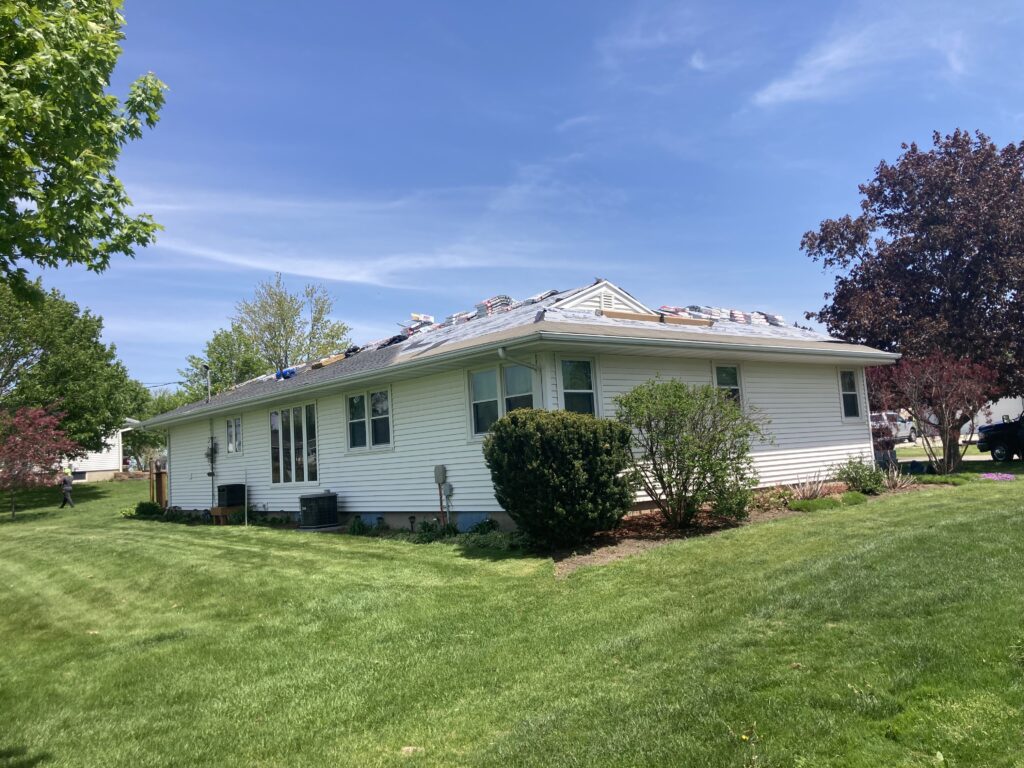 Finishing up the shingles on a home in Stanwood, Iowa.