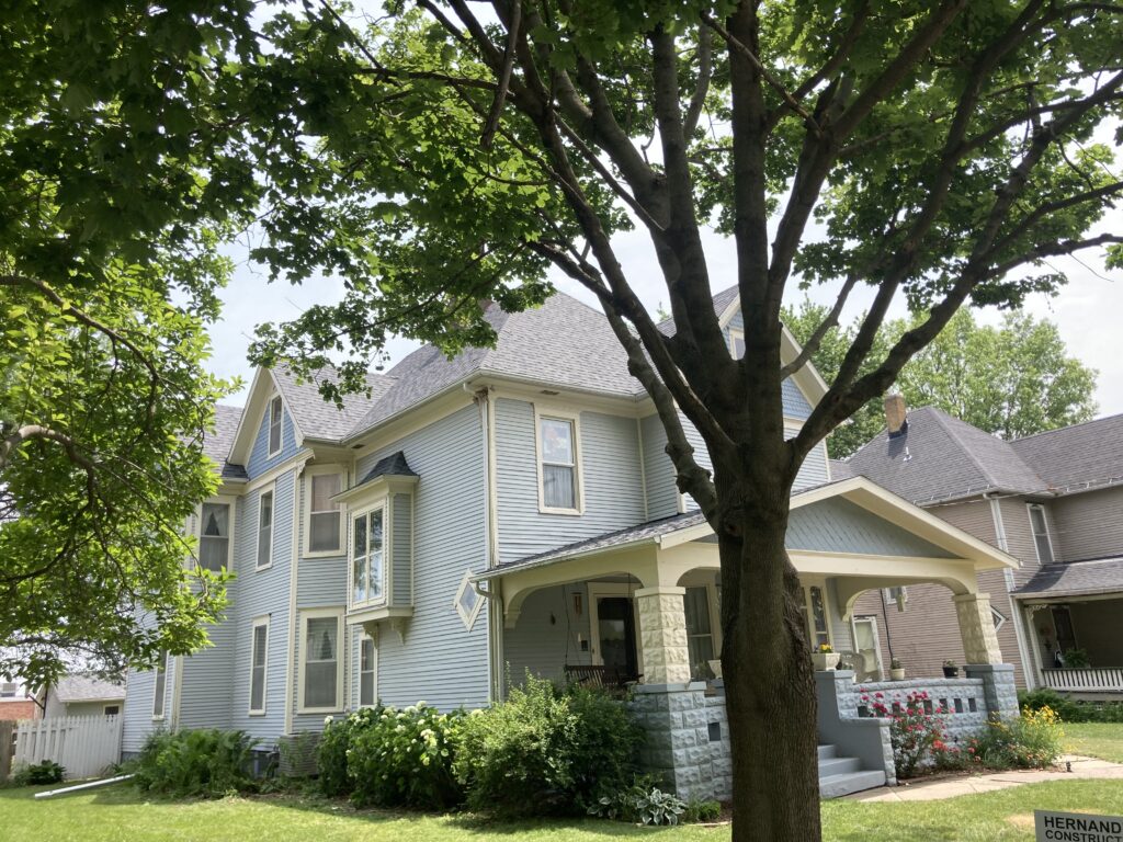 Front of home with new shingle roof on a Victorian-style home in West Liberty, Iowa