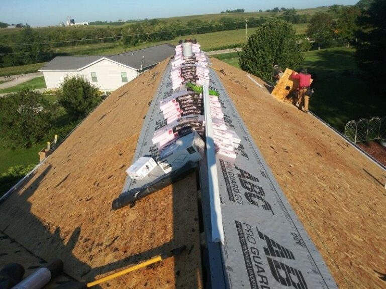 Replacing a roof decking board on a home in West Branch, Iowa.