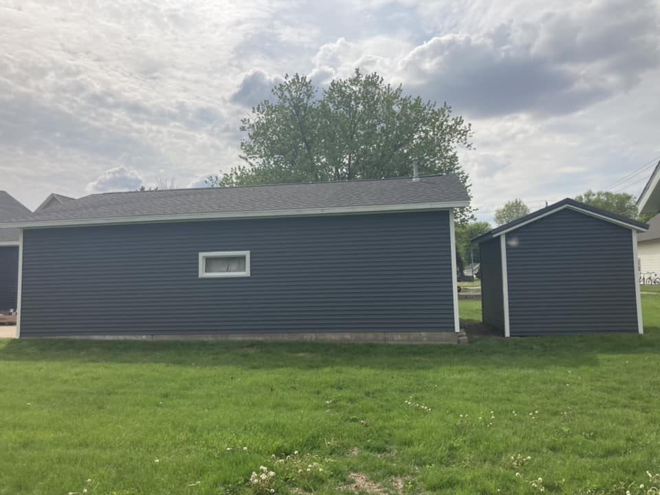 Side of the garage with new vinyl siding in Durant, Iowa