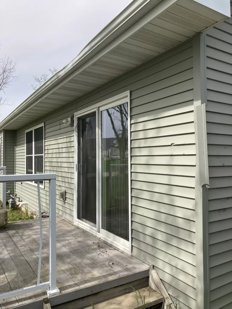 Storm-Damaged Home Siding and gutters in Tipton, Iowa