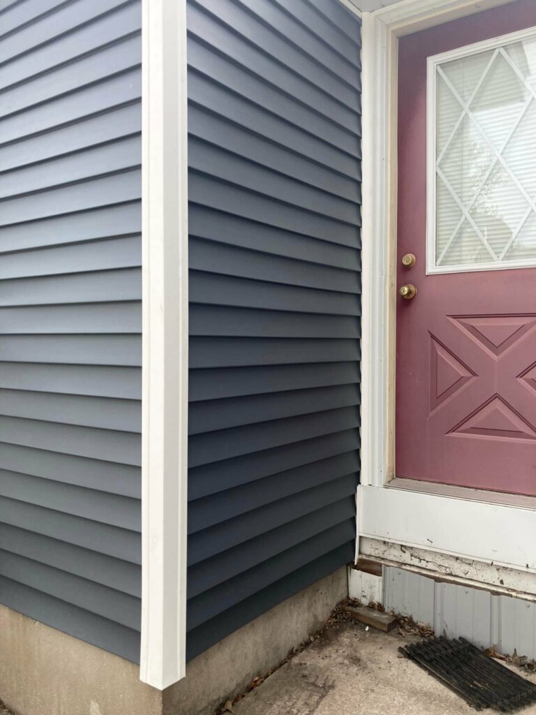 Vinyl siding installed by the back door on a home in Durant, Iowa