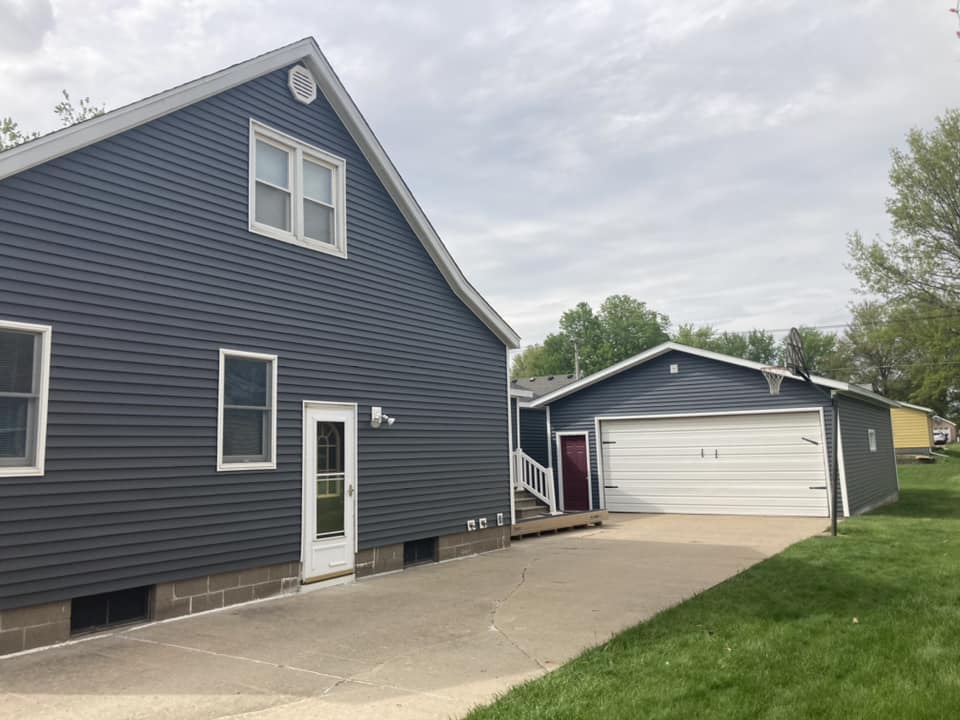 Vinyl siding with white trim installed in Durant, Iowa