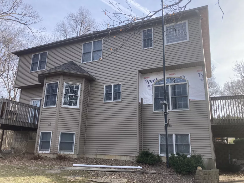 Finishing up the siding on a home in Tipton, Iowa