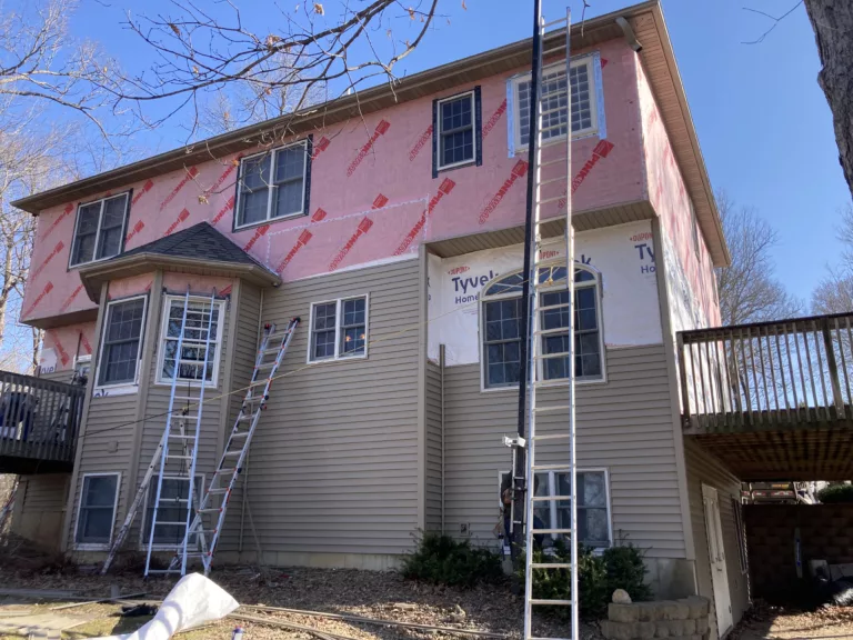 Wind and hail damaged siding removed on a home in Tipton, Iowa