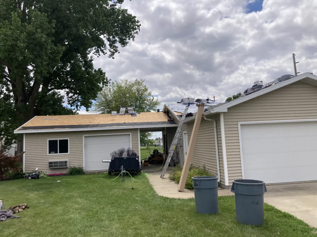 New asphalt shingles staged on on the roof in Stanwood, Iowa