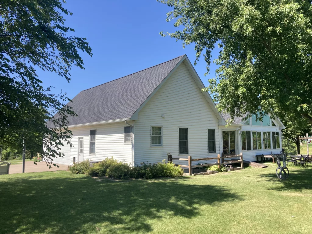 Back of home with a roof replacement in Tipton, Iowa