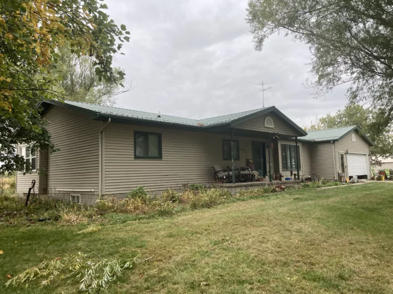 Expert Hail Damage Metal Roof Repair and Replacement in West Branch, Iowa with Seamless Color Matching