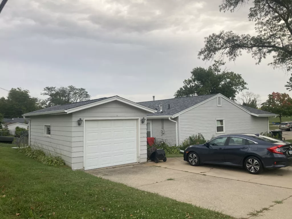 Finished roof with new asphalt shingles and a reinforced rafters on a home in Cedar Rapids, Iowa