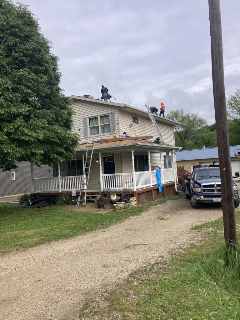 Hernandez KD Construction Crew removing the age-related damaged roof in Davenport, IA