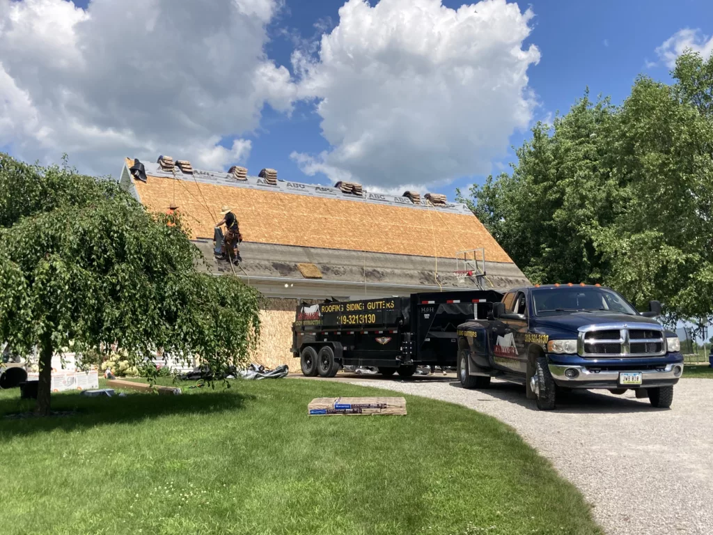 Hernandez KD Construction Crew working on the roof in Tipton, Iowa