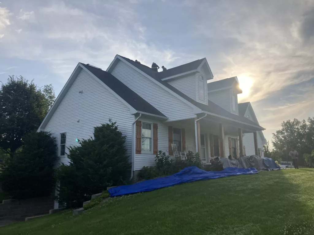 Hernandez KD Construction crew working on the roof replacement in the morning in Tipton, Iowa