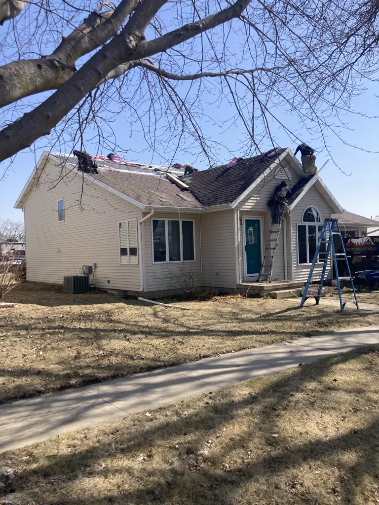 Crew working on the Storm Damaged Roof in Tipton, Iowa