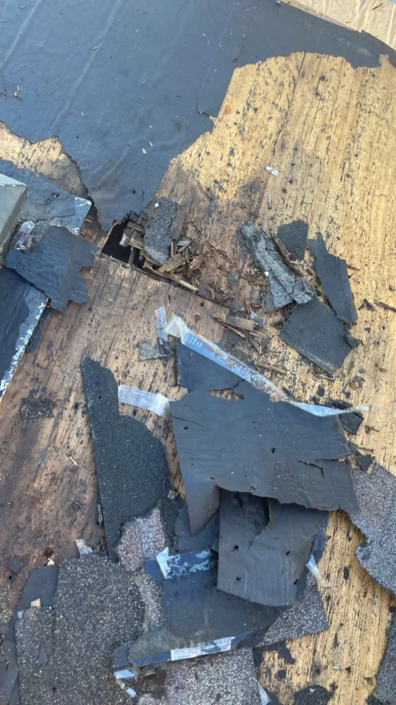 Detail of storm and water damaged roof decking on a home in Tipton, Iowa
