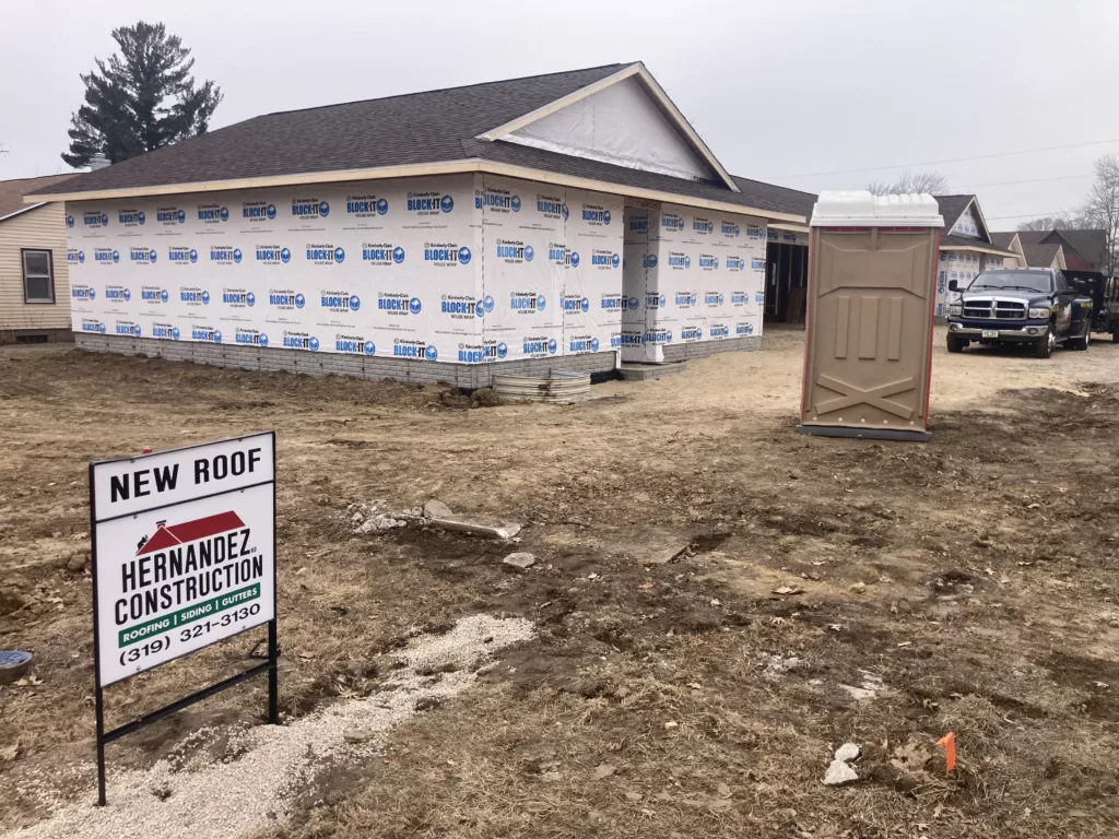 Hernandez KD Construction Sign - New roof on a newly constructed duplex in Tipton, Iowa