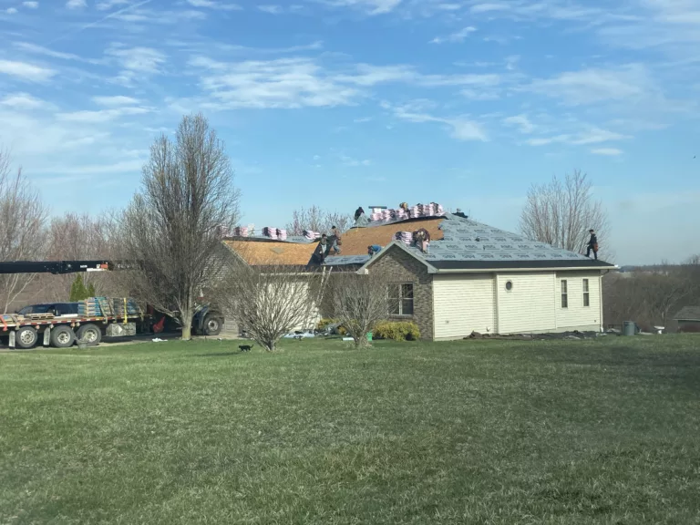 Crew working on Wind & Hail Damaged Roof with Shingle Removal and Replacement, in Tipton, Iowa
